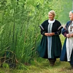 라트비아 vs 에스토니아 역사 비교 - **Ancient Baltic Life in Harmony with Nature:**
A vibrant, sun-drenched scene depicting early Fi...